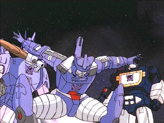 Galvatron squats in front of Cyclonus and Soundwave