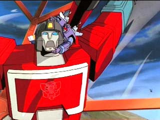 Rumble holds onto Perceptor's head