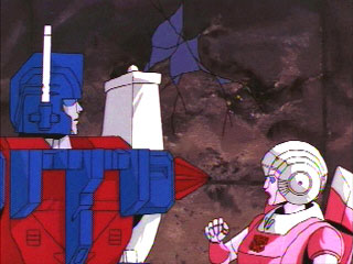 Arcee looks shocked at Ultra Magnus' missile
